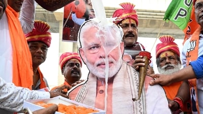BJP workers perform a milk abhishek on a photo of Prime Minister Narendra Modi on the banks of the Ganga River to celebrate his 76th birthday, in Patna on Wednesday. (ANI)