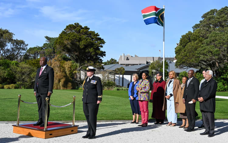 South Africa High Commissioner Johnny Sexwale (left) said migrants to New Zealand should stop "bashing" and badmouthing their home country.