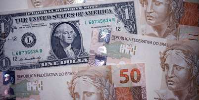 Nesta ilustra&ccedil;&atilde;o, tirada em 18 de dezembro de 2024, s&atilde;o mostradas notas do real brasileiro e do d&oacute;lar americano. REUTERS/Amanda Perobelli/Ilustra&ccedil;&atilde;o Foto: Reuters