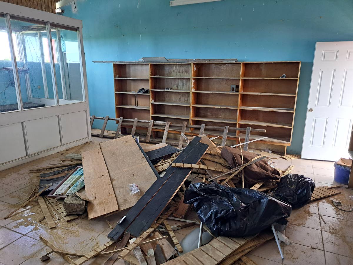 A pile of refuse spotlights the remains of the library space at Herbert Morrison Technical High School in St James. The school library was significantly damaged during the passage of Hurricane Melissa on October 28, 2025.