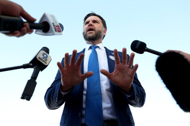 Vice President JD Vance speaks with reporters at Cincinnati/Northern Kentucky International Airport in Hebron, Kentucky, on Friday before departing for a rally in Lima, Ohio.