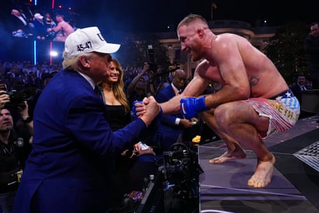 Justin Gaethje shakes hands with President Trump at ringside as Melania Trump smiles beside him