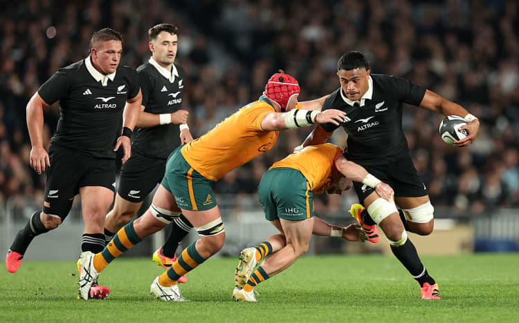 Tupou Vaa'i fends off the Wallabies at Eden Park.