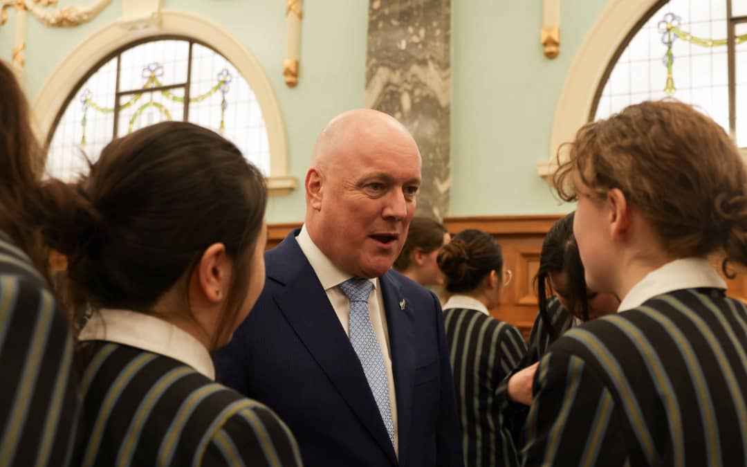 Prime Minister Christopher Luxon with students at the government announcement of a plan to ban social media for under 16 year olds.
