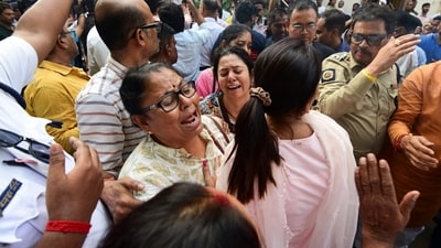 Relatives mourn as they arrive to collect the bodies of victims from a morgue after a stampede during a Durga Puja festival in Kolkata. (Reuters)